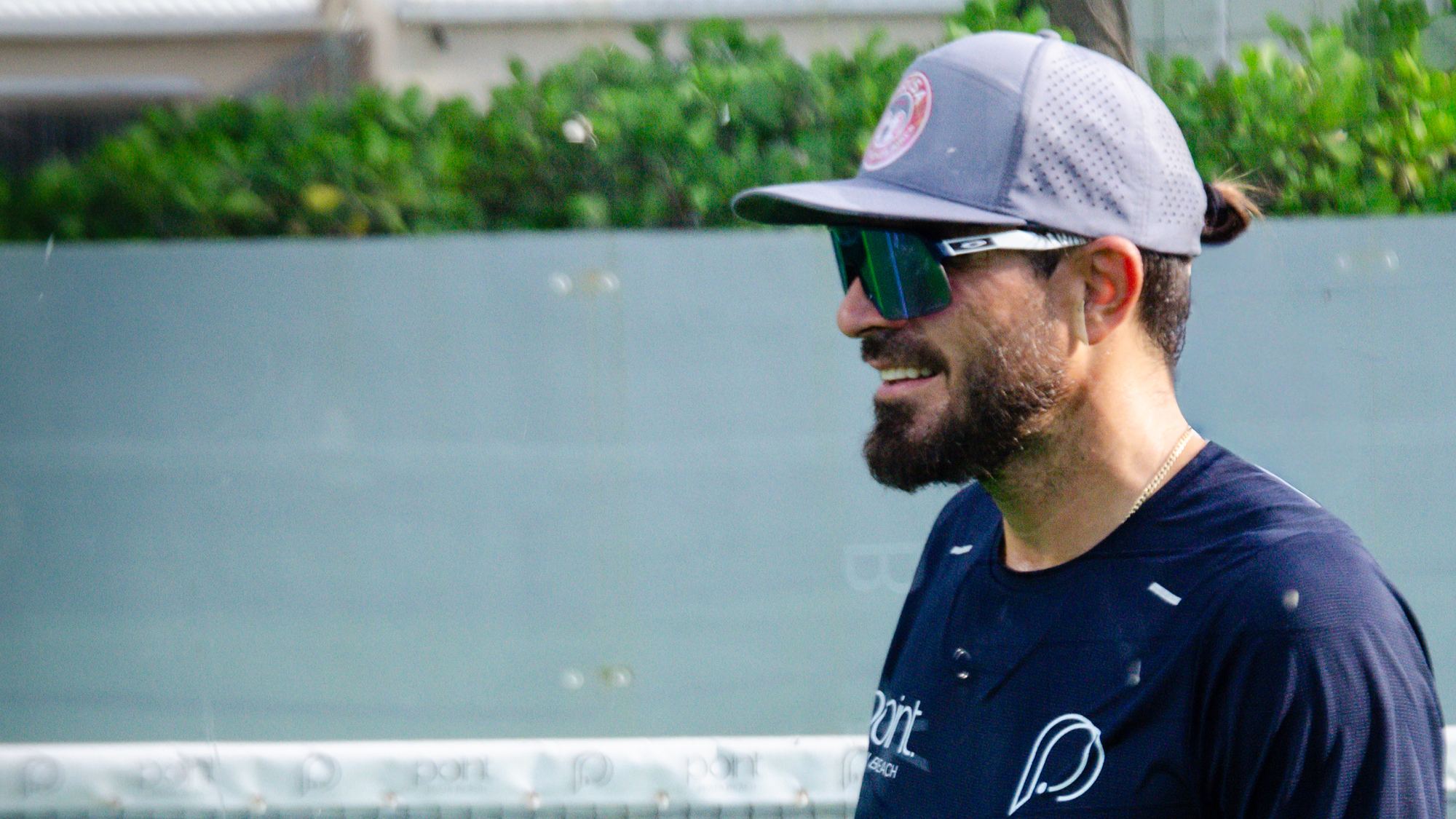 A player smiling on court at Point